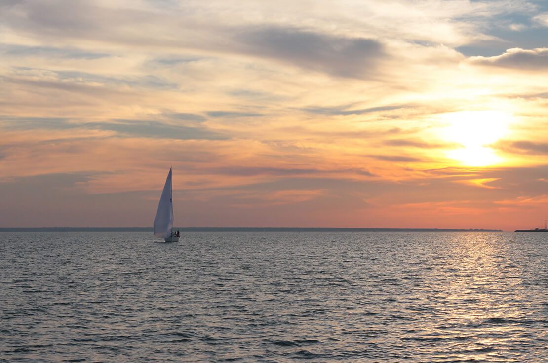 Darwin sunset with a sail boat